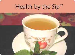 Cup of tulsi tea with a green leaf; opens to article on Health by the Sip.
